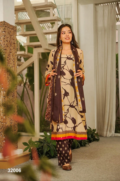 Woman in a patterned outfit standing in a modern indoor setting with plants and architectural elements.