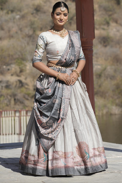 Woman in traditional saree standing outdoors with a scenic background
