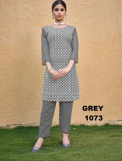 Woman wearing a gray patterned outfit with 'GREY 1073' text on a beige wall background