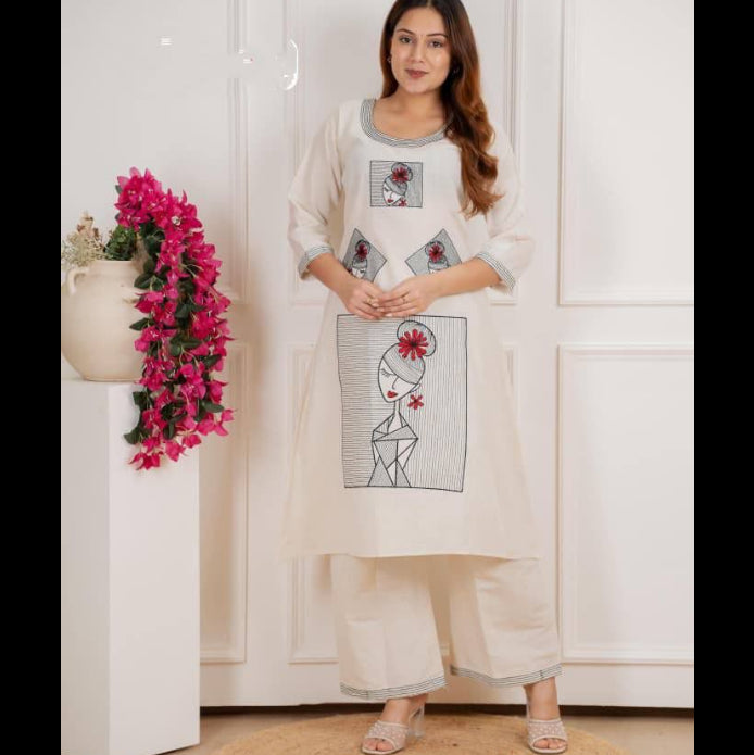 Woman wearing a white outfit with floral and abstract design in a minimalistic setting