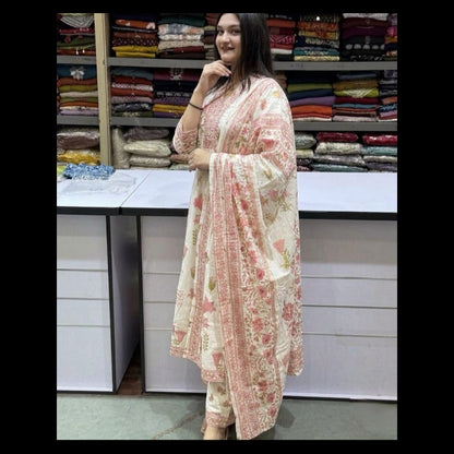 Woman wearing a floral outfit in a fabric store