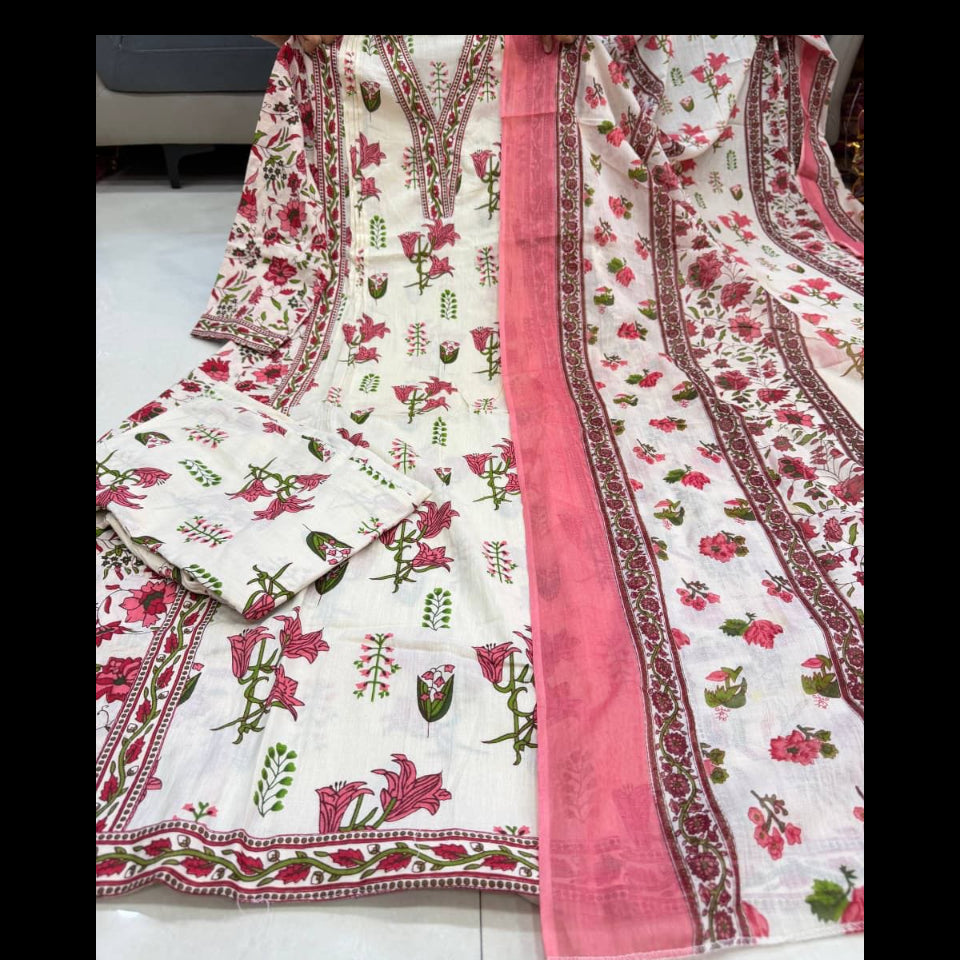 Floral patterned fabric with pink border held by a person